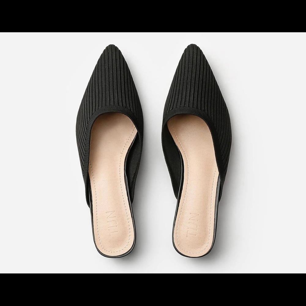 Black TIJN mules.